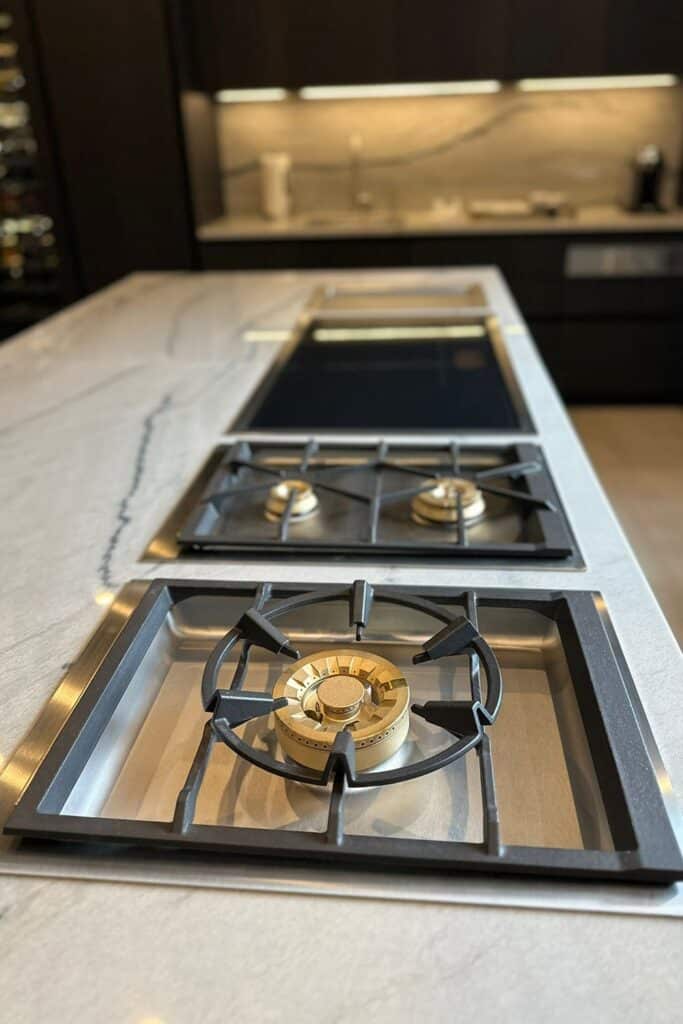 Luxury kitchen with Gaggenau gas cooktops, induction cooktop, and Teppan Yaki