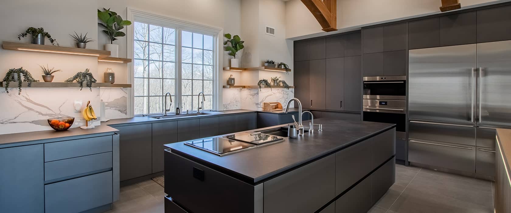 Luxury MandiCasa kitchen in Rumson NJ with cabinets in dark Micalized Ardesia.