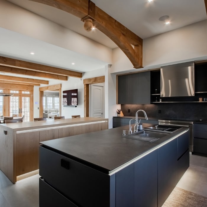 Contemporary kitchen in dark lacquer and light oak in traditional New Jersey home.