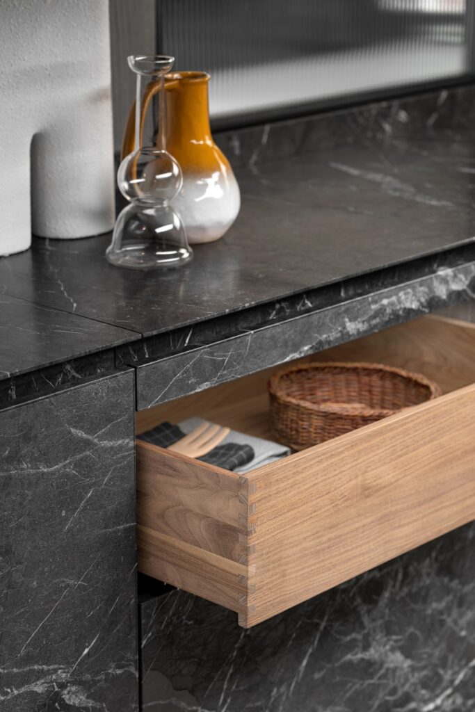 Walnut drawer with dovetail joints custom made in Italy for a bespoke American kitchen.