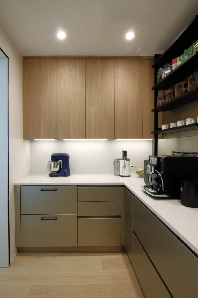 Modern kitchen pantry with open shelves and counter space for small appliances