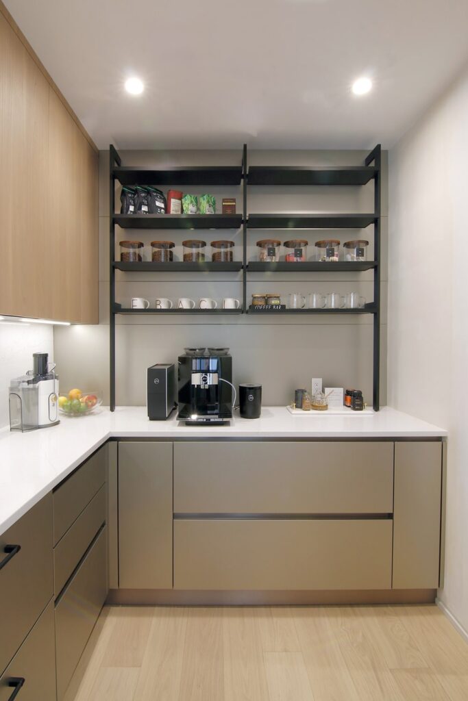 Modern kitchen pantry with open shelves and counter space for small appliances